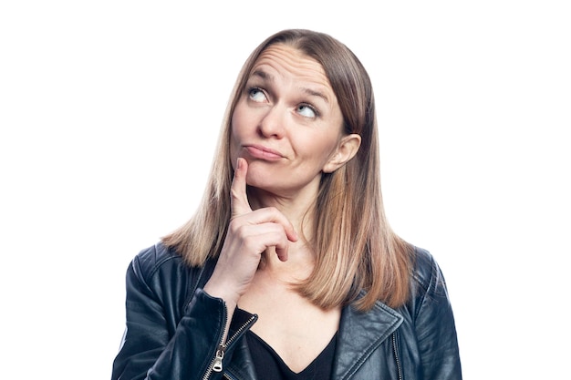 Young woman with a dreamy expression in a black leather jacket Isolated on white background Closeup