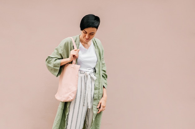 Young woman with eco bag enjoying morning. Eco friendly concept.