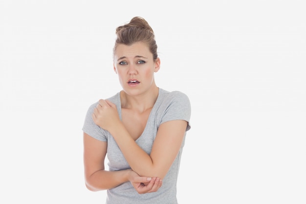 Young woman with elbow pain