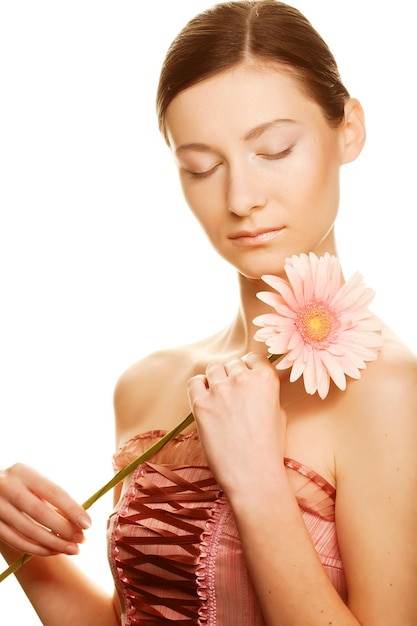 Young woman with gerber flower