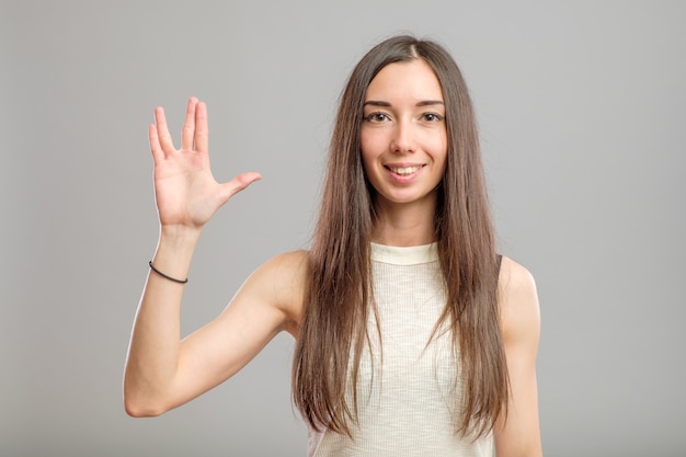 Young woman with long hair in a casual outfit