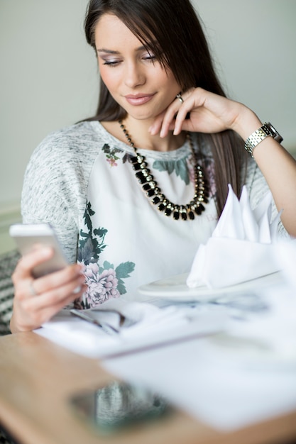 Young woman with mobile phone