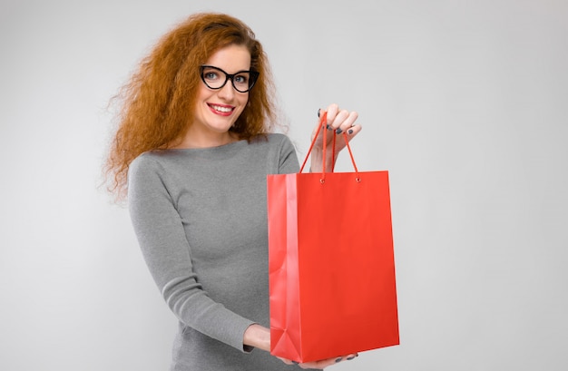 Young woman with paper bag