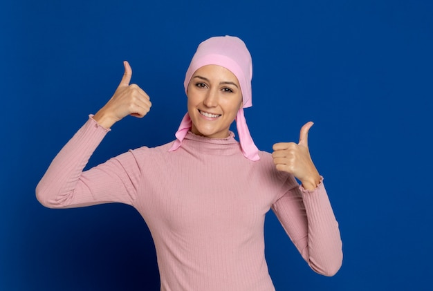 Young woman with pink scarf on the head