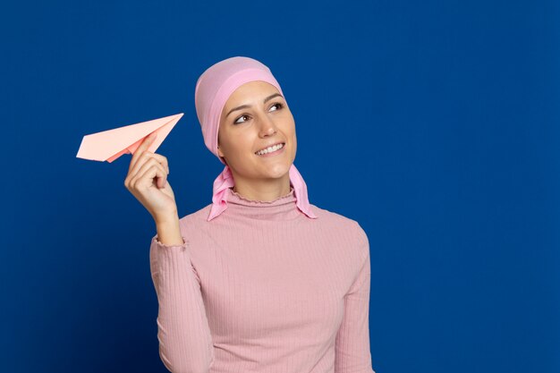 Young woman with pink scarf on the head