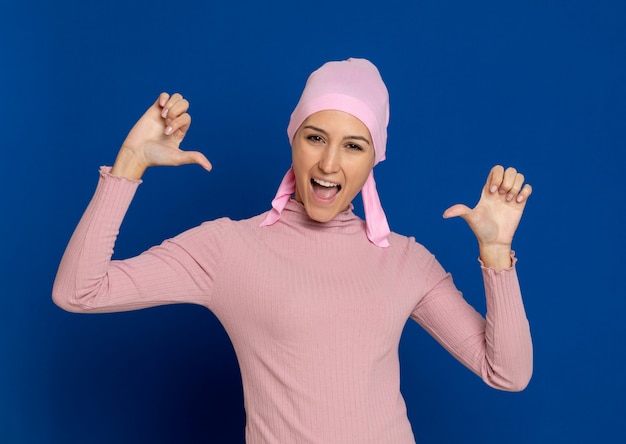 Young woman with pink scarf on the head