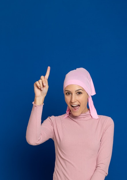 Young woman with pink scarf on the head