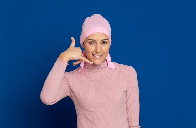 Young woman with pink scarf on the head