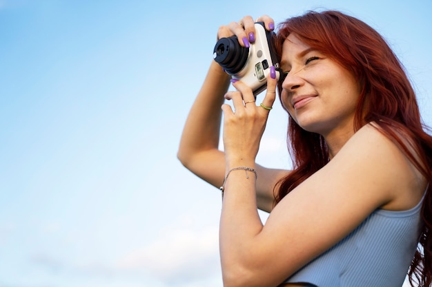 Young woman with red hair smiling