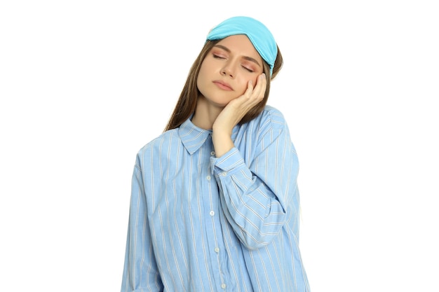 Young woman with sleep mask isolated on white background