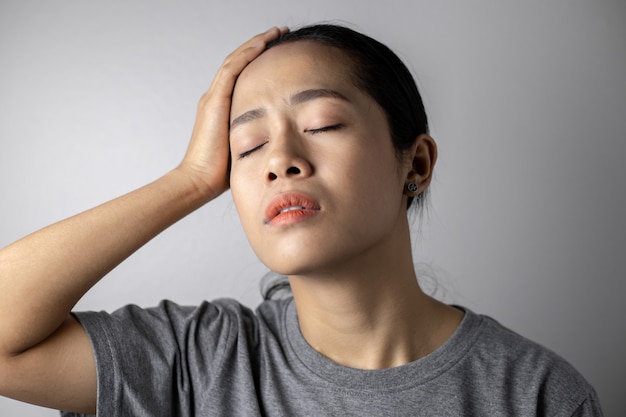 Young woman with of stress and headaches.