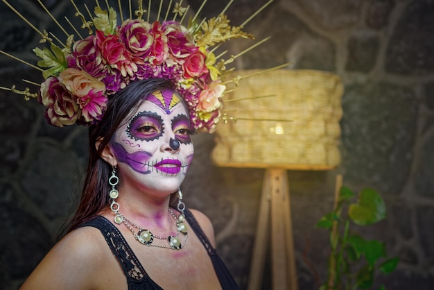 Young woman with sugar skull makeup Day of The Dead Catrina portrait