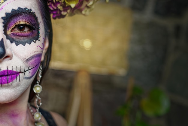 Young woman with sugar skull makeup Day of The Dead Catrina portrait