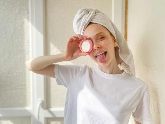 Young woman with a towel on her head