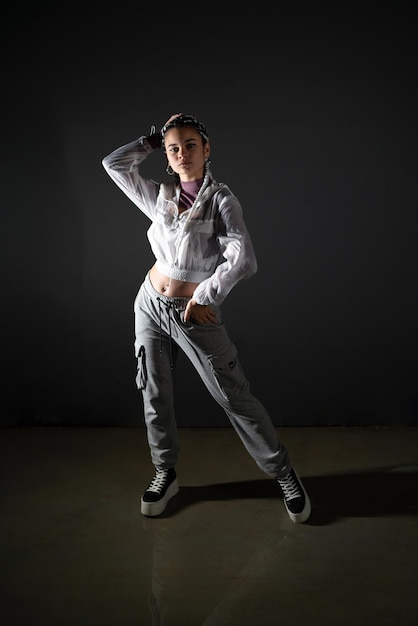 Young woman with urban style posing in studio shot