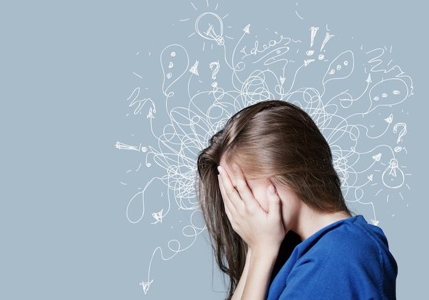 Young woman with worried stressed face expression with illustration