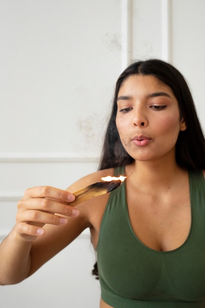 Young woman with yoga essentials