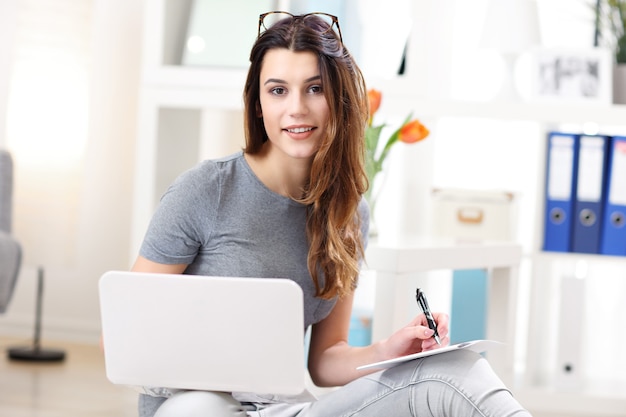 young woman working in her home office