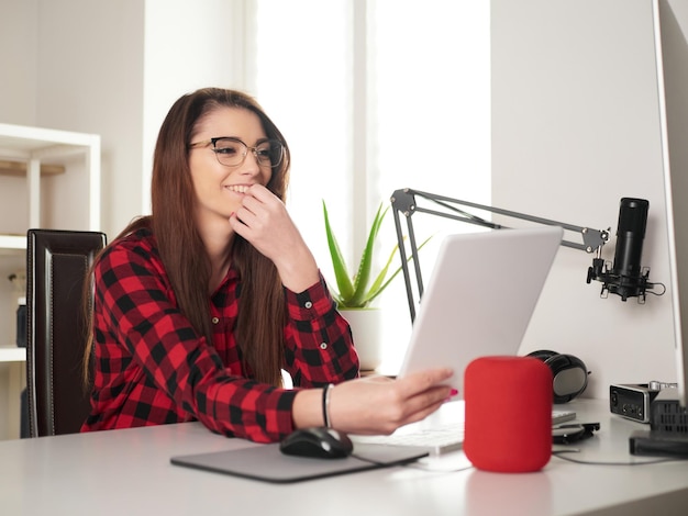 Young woman working at home on desktop pc and digital tablet