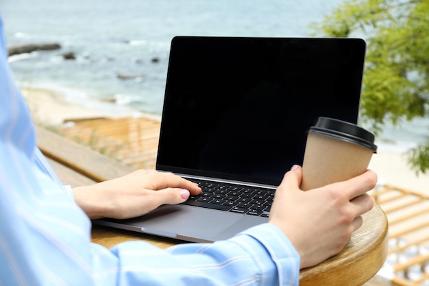 Young woman working on laptop outdoor concept of freelancer