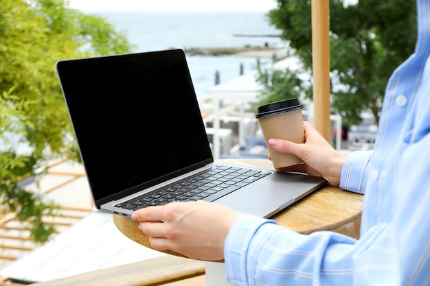 Young woman working on laptop outdoor concept of freelancer