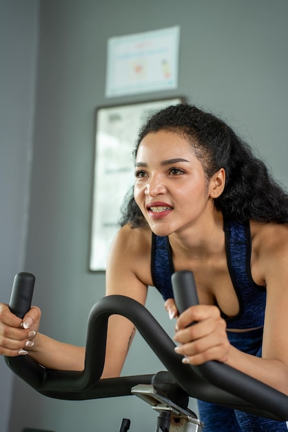 Young woman workout in gym healthy lifestyle Young People women doing sport in the gym for fitness