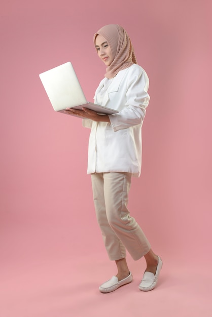 Young woman works on a laptop