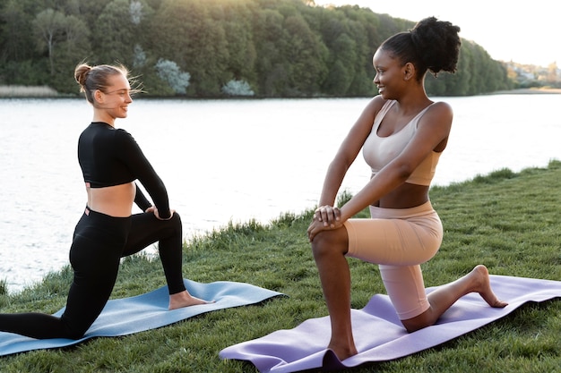 Young women doing fitness outdoors