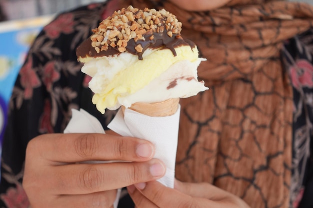 Young women eating chocolate flavor ice cream