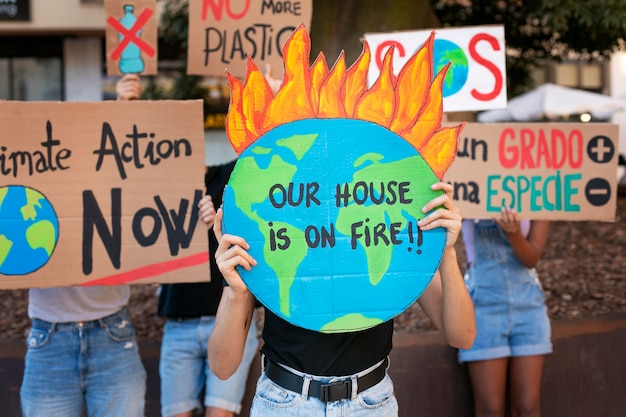 Photo young women protesting against climate change