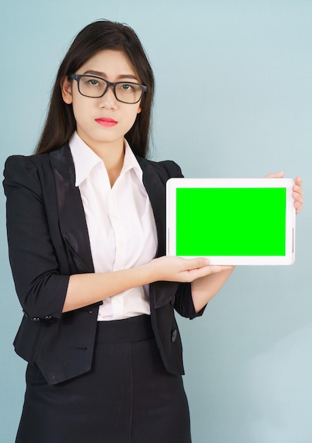 Young women in suit holding her digital tablet mock up