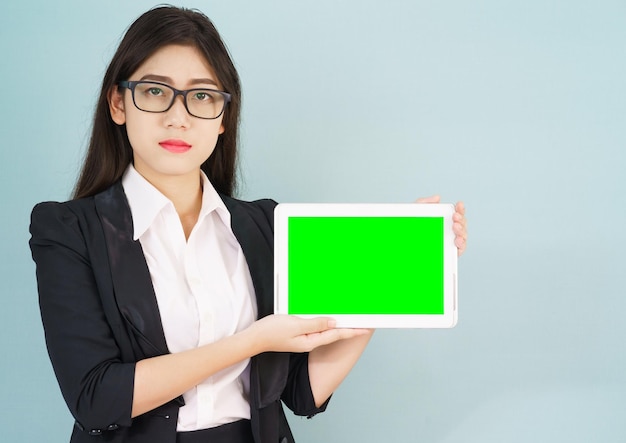 Young women in suit holding her digital tablet mock up