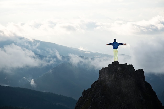 Young women on the top of the mountains.