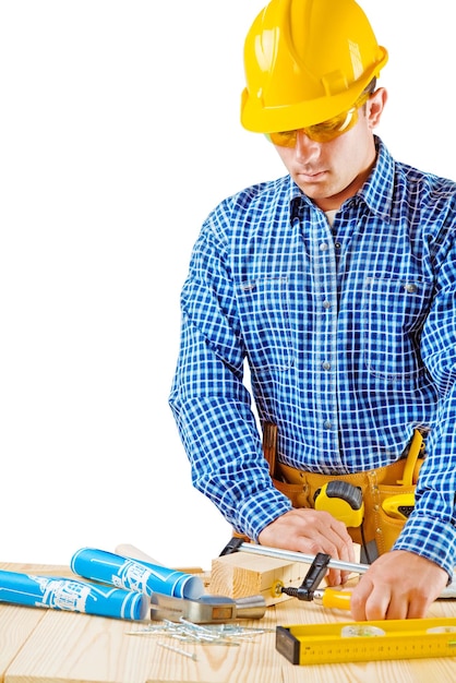 A young worker near the working table isolated