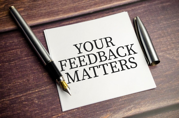 Your feedback matters words on sticker and pen