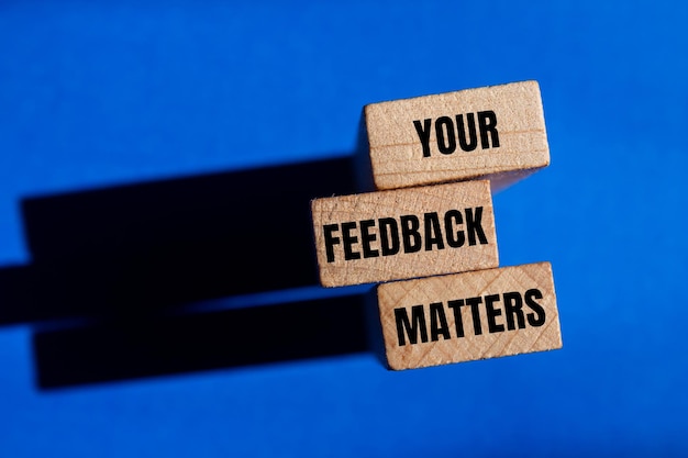 Your feedback matters words written on wooden blocks with blue background Conceptual your feedback matters symbol Copy space