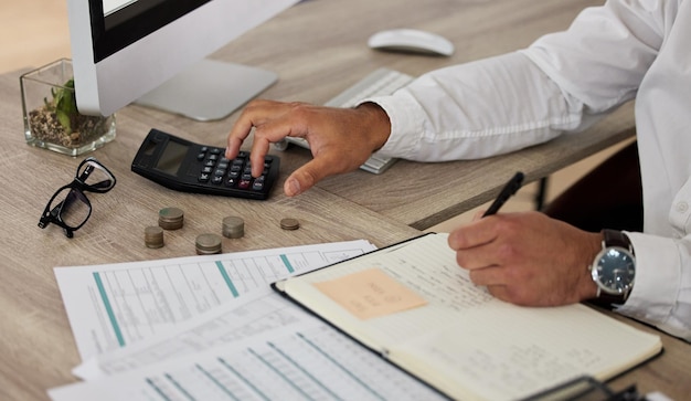 Your financial future matters Shot of a businessman calculating his finances and making a list