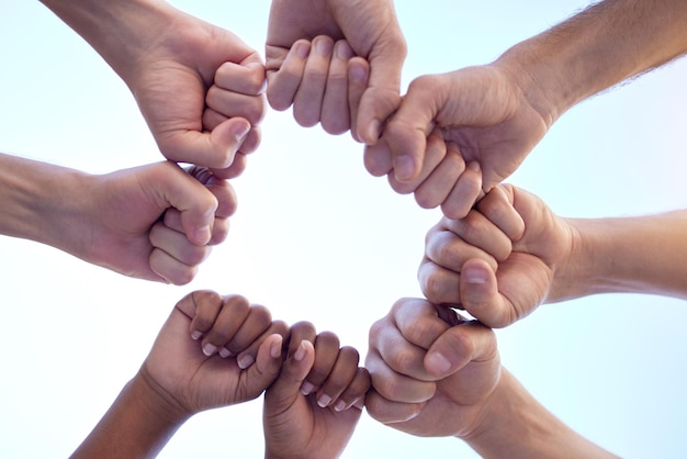 Your support is always appreciated Shot of a group of people fist bumping one another in a circle