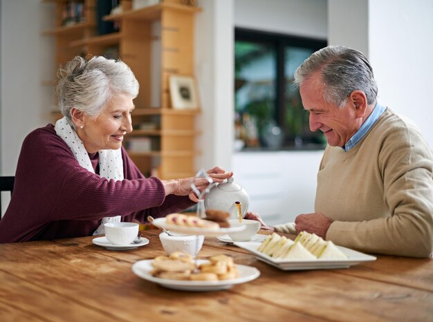 Youre my cup of tea love Cropped shot of a senior couple having lunch at home