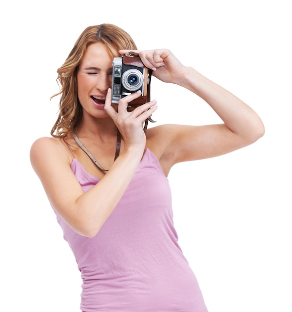 Youre so photogenic Studio shot of a young woman taking a picture with a vintage camera