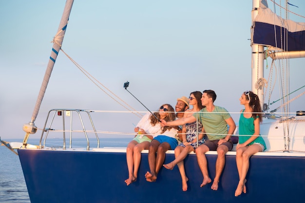 Youth makes selfie on a yacht