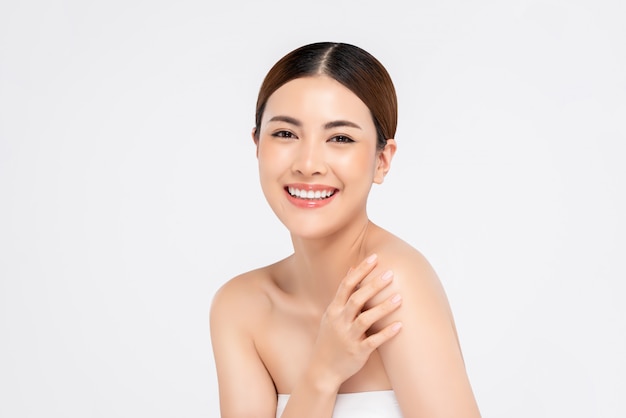 Youthful bright skin smiling pretty Asian woman for beauty concepts