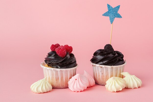 Yummy cupcake on light pink background close up