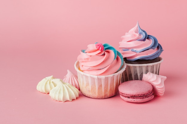 Yummy cupcake on light pink close up