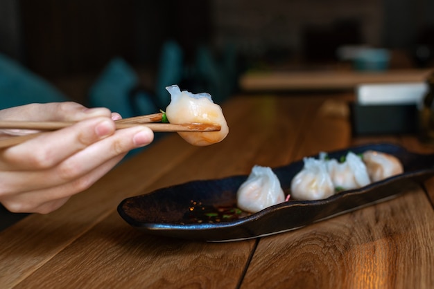 Yummy and hot chinese dumplings with chopsticks