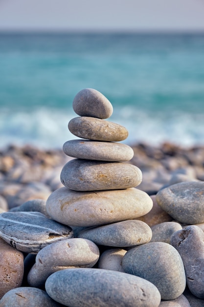 Zen balanced stones stack on beach