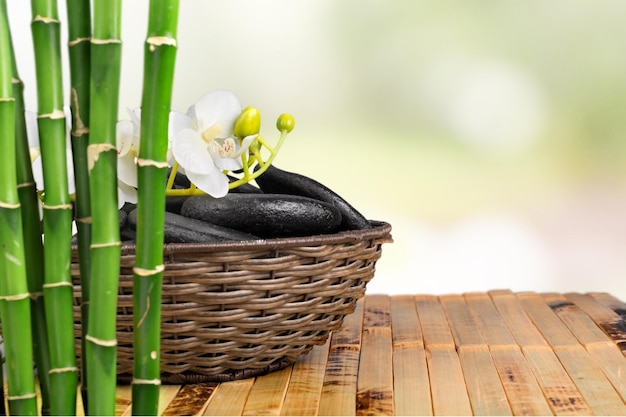 Zen stones and bamboo on wooden table