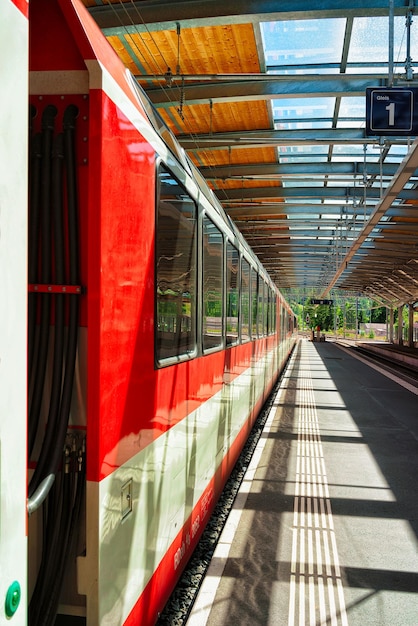 Zermatt, Switzerland - August 24, 2016: Concourse and train at Railway train station in Zermatt, Valais canton, in Switzerland.