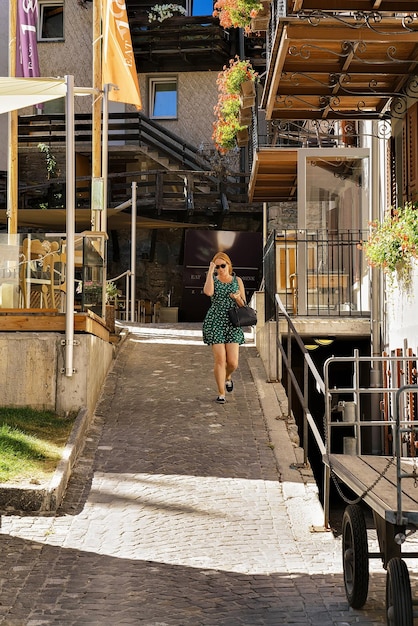 Zermatt, Switzerland - August 24, 2016: Ypung woman at the city center of Zermatt in summer