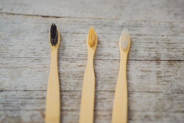 Zero waste concept Bamboo toothbrush on wooden background Plastic free essentials teeth care Sustainable lifestyle